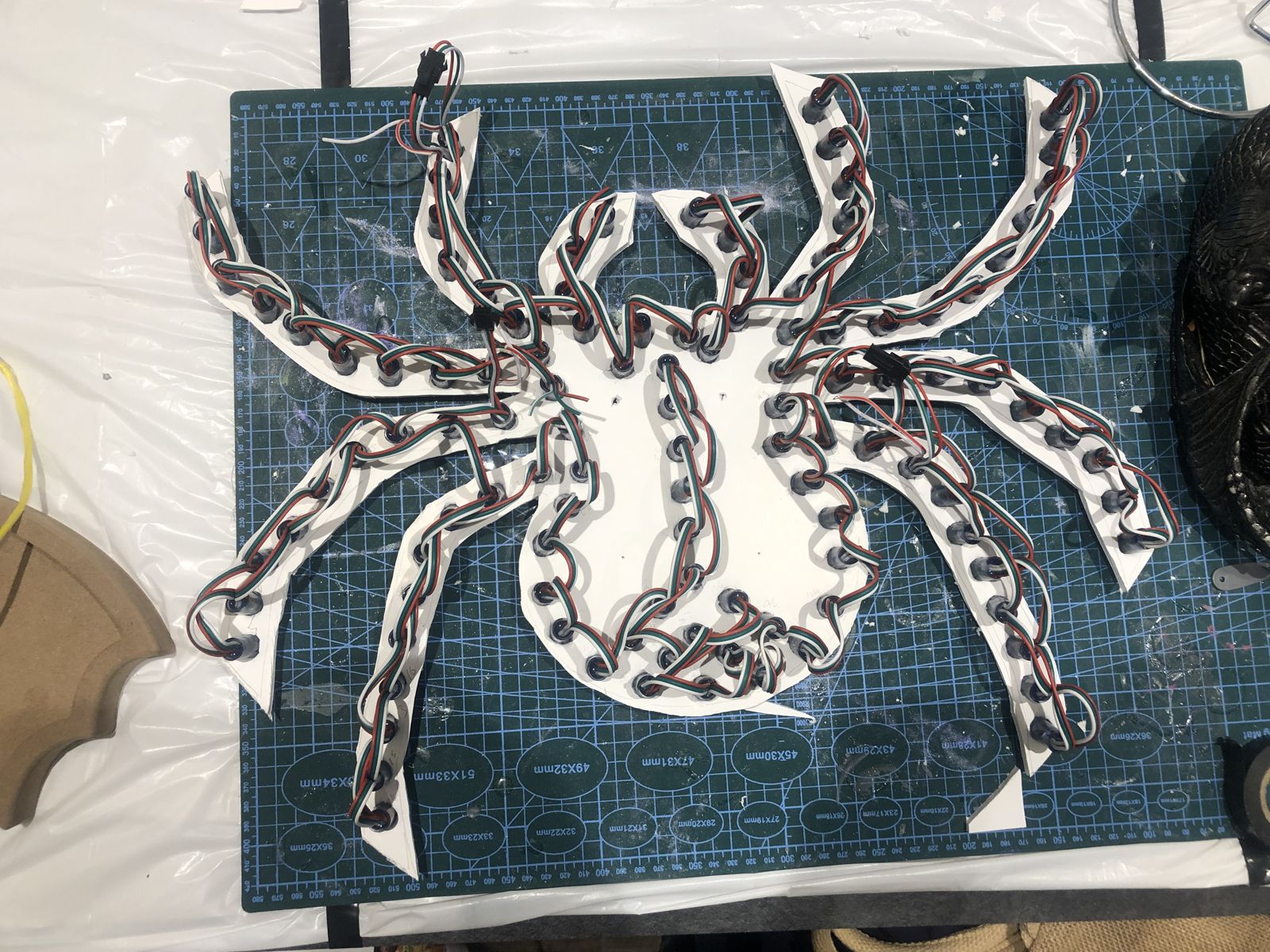 The back of the spider with the WS2811 pixel string pushed through and wired leg by leg